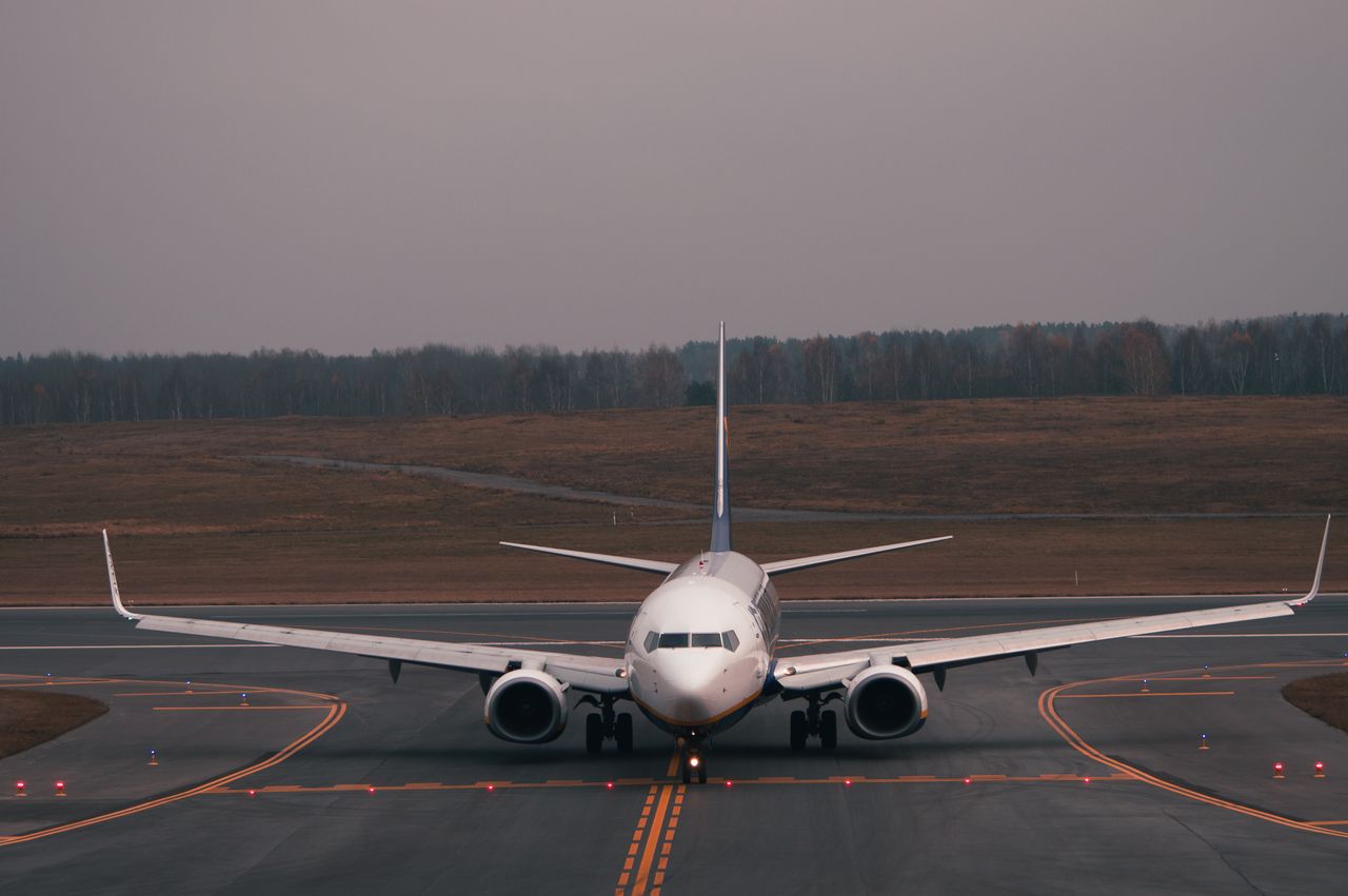 Services A commercial airplane taxiing on the runway at an airport in Vilnius, Lithuania.
